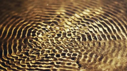 Vibrational waves at the surface of the water. Water cymatics - Powered by Adobe