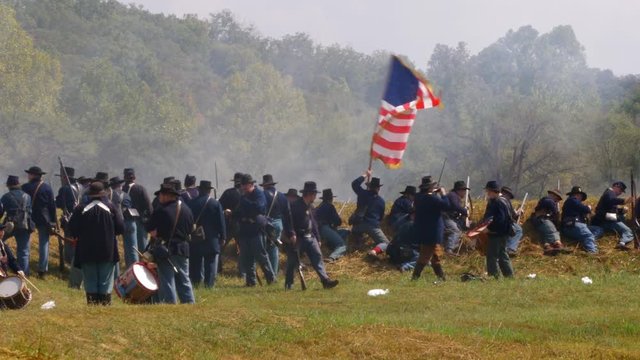Union soldier waving a flag.