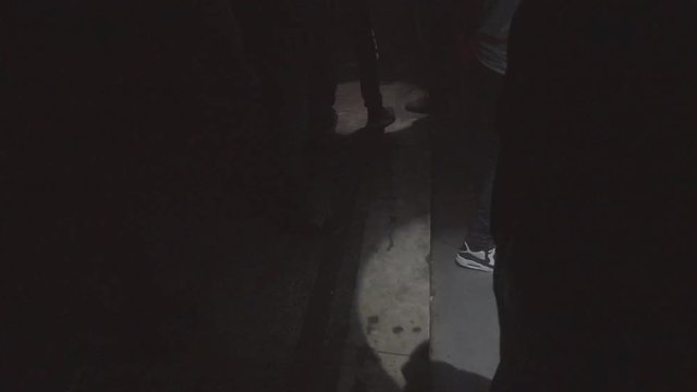 People between led pars going on/off. Can be seen as some sort off video effect.