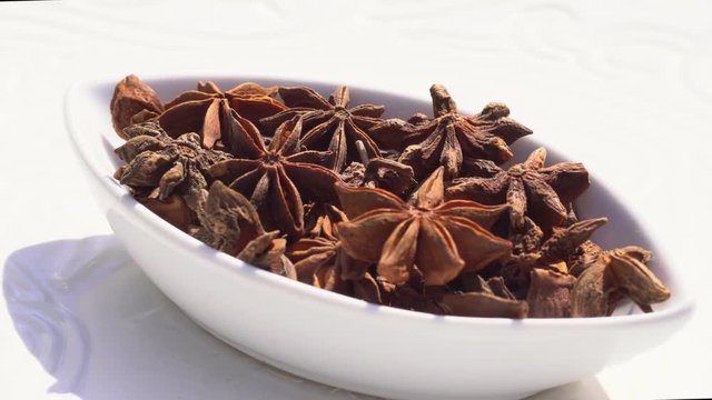 Dry spices anisetree on a rotary table. 4K. Macroshooting.