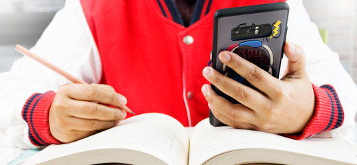 student using smart phone in class