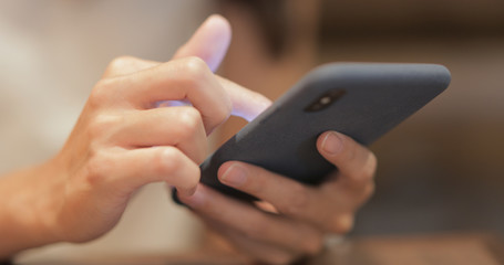 Woman use of smart phone in restaurant