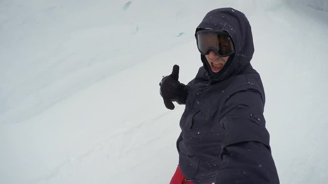 Snowboarder Waving to Friends on Social Media