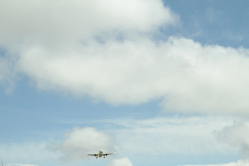 Naklejka na ściany i meble Airplane against sky