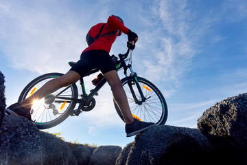 Fototapeta na wymiar Mountain Bike cyclist on top of a mountain .