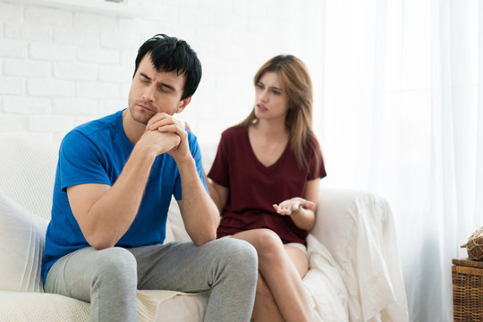 Couple having argument conflict, bad relationships. Angry fury woman screaming man stress in house.