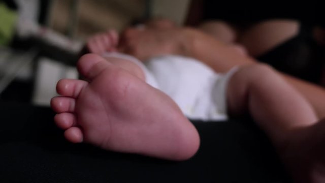 Woman breast feeding newborn child