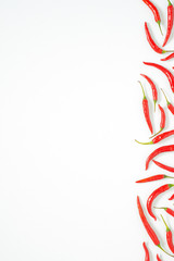 fresh chili peppers on white background with copy space. flat lay