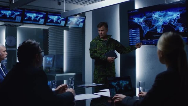 High-Ranking Military Man holds a Briefing to a Team of Government Agents and Politicians, Shows Satellite Surveillance Footage. 