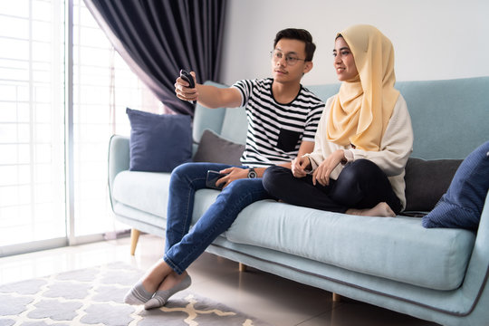 Asian Malay Couple Watching Tv Together