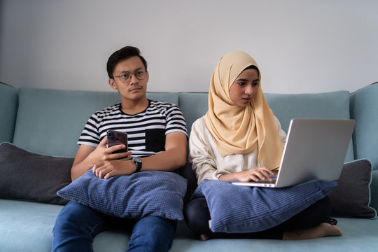 Asian Malay Couple Watching Tv Together