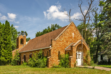 Sunlit Orange Brick Church Needing a Bit of Work