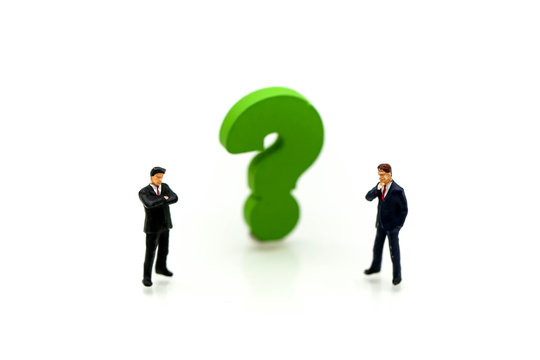 Miniature people : Businessman with THE QUESTION MARK using for concept Punctuation Day