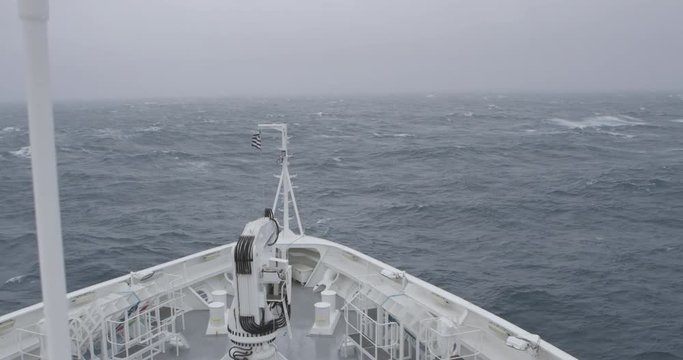 Slow motion imagery of crossing the Drake Passage to Antarctica in a storm. A dramatic scene with heavy wind and big waves. Shot in 4k with RED Epic Dragon.