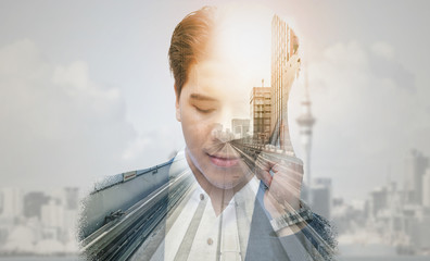 Double exposure businessman using mobile phone.