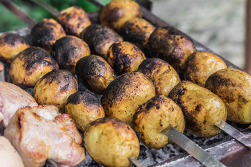 Grilled potato marinated in herbs and spices