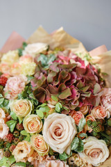Floral Arrangement. Mix flowers. Beautiful summer bouquet. Concept of a flower shop. Profession florist