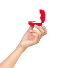 hand holding a Red velvet box for the ring isolated on a white background.