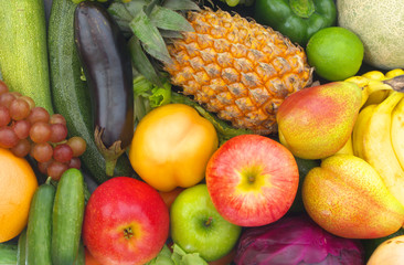 Mixed fresh colorful fruits and vegetables as healthy and natural food close up