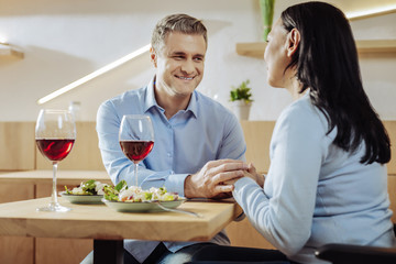 Time together. Happy smiling couple having dinner sitting in a restaurant