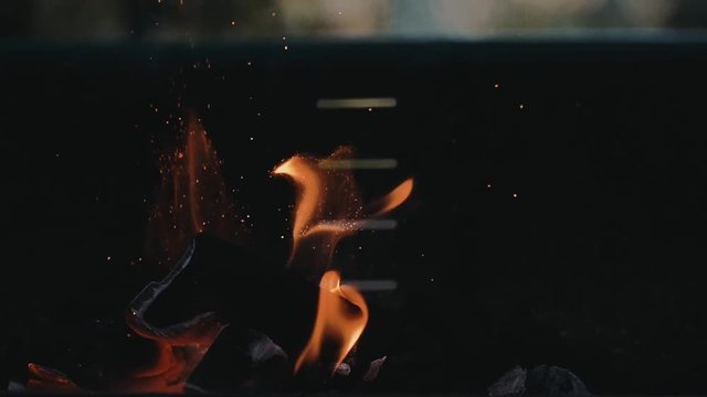
Slow Motion Barbecue Camp Charcoal Grill Fire And Particles With Shallow Depth Of Field Closeup Cinematic