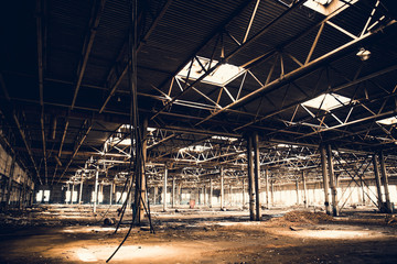 Abandoned ruins of industrial factory building, corridor view with perspective and light, ruins and...