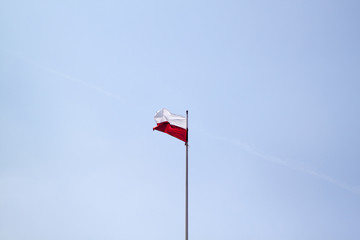 Poland flag on a blue sky background