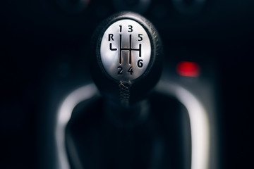 Manual gearbox handle in the car middle 