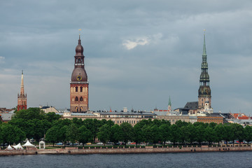 Naklejka premium View of the spiers of the cathedrals of the old city of Riga, from the Daugava river