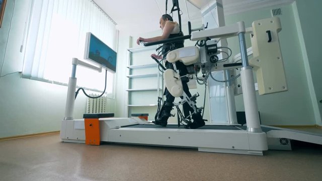 A disabled man walks with a prosthesis, rehabilitation concept.