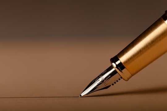 Parker Fountain Pen Draws a Straight Line on the Brown