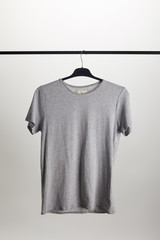 one grey shirt on hanger isolated on white