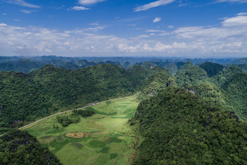 Fototapeta na wymiar Aerial view of Karst mountains and rice fields