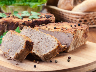 Traditional delicious meat pate with chicken liver on cutting board
