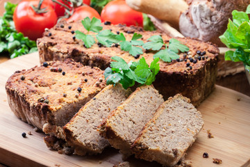 Traditional delicious meat pate with chicken liver on cutting board