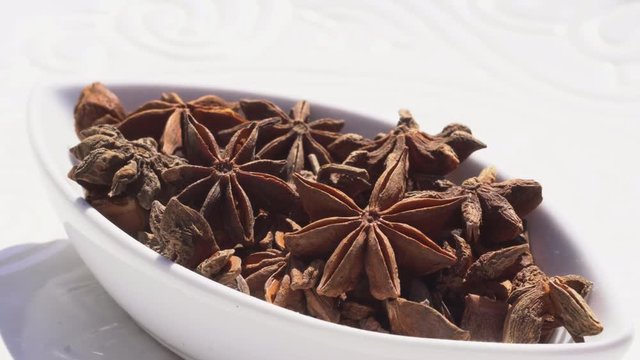 Dry spices anisetree on a rotary table. 4K. Macroshooting.
