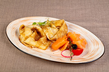 Russian pancakes with salmon