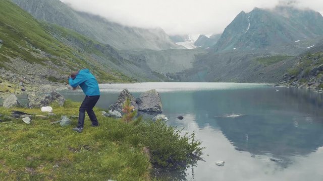 Altai, Kucherla, RUSSIA: Girl jump. Hands in the air.. 4k Slow motion