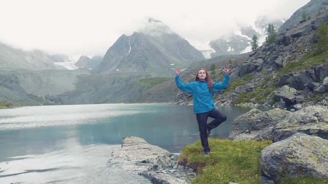 Altai, Kucherla, RUSSIA: girl doing yoga. Indian dance. Lotus 4k Slow motion