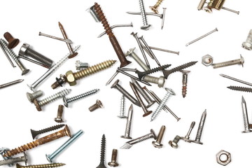 Pile of old, rusty metal nails isolated on white background, top view