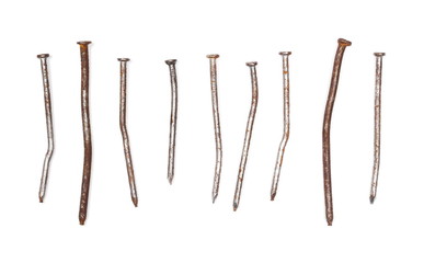 Pile of old, rusty metal nails isolated on white background, top view