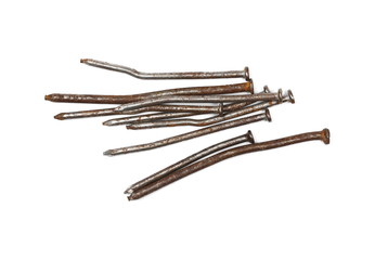 Pile of old, rusty metal nails isolated on white background, top view