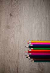 Fototapeta premium Background With Colored Pencils On Wooden Background. Back To School Concept