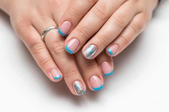 Blue French manicure with a cracked falcon, craquelure on short square nails
