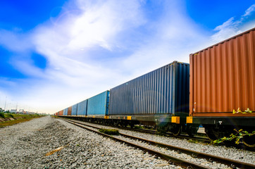 Fototapeta premium Container on train ,rail way on small stone is waiting for sent to seaport in blue sky is so beautiful sky this image for import and export logistic concept