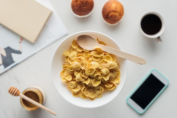 top view of bowl of dry cereal for breakfast on white