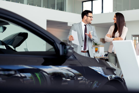 Sales Manager At A Showroom Car Is Worth To The Buyer