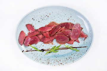 ostrich basturma,with arugula