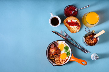 English breakfast with coffee, orange juice and toast. Top view,