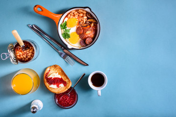 Traditional English Breakfast Food on the table eggs, coffee, toast,